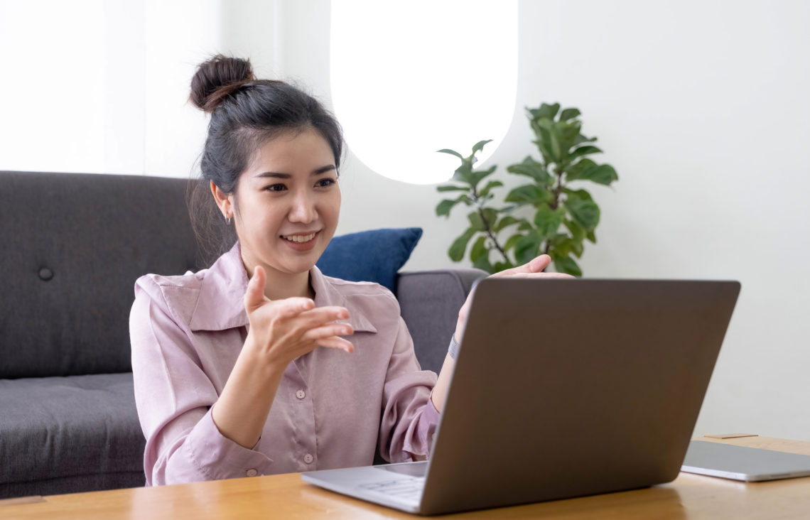 Woman working from home with a laptop.